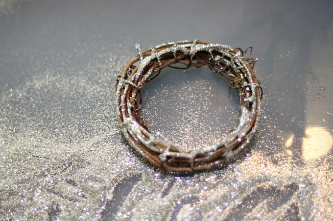 glitter being added to a wreath