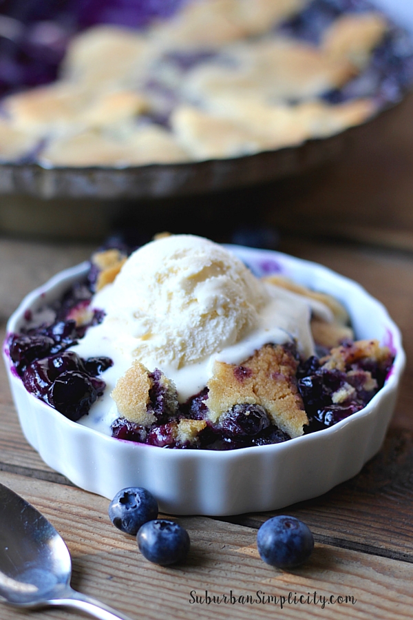 Delicious Cobbler with blueberries with vanilla ice cream on top.