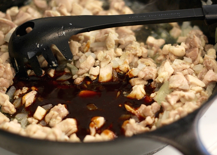 Chicken chunks being cooked in a pan