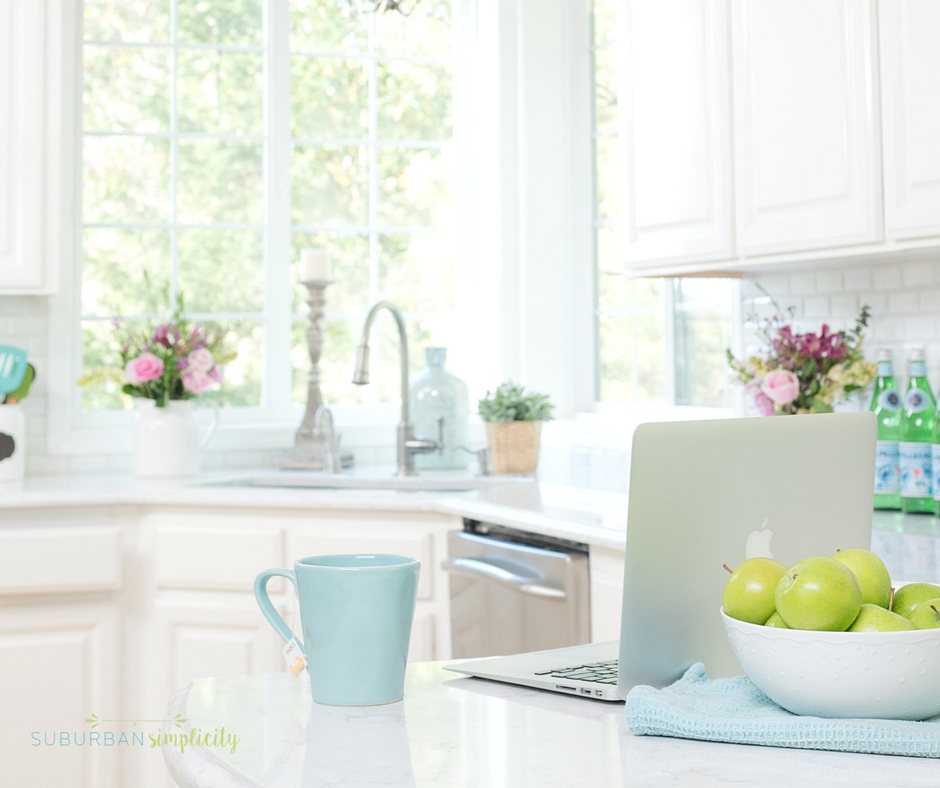 Kitchen with a computer and cup of tea on the counter