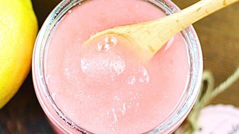 Jar of pink lemonade body scrub.