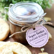 Sugar Cookie Sugar Scrub in a glass jar with a tag tied around it.