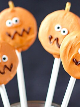 Four Halloween cookies on a stick.