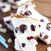Cranberry Bliss Saltine Toffee is the best holiday treat idea! Crispy crackers, sweet caramel and melted white chocolate topped with tart cranberries. The perfect dessert combination! #cranberryblissrecipes #holidaydessert