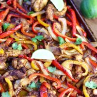 Baked chicken fajitas on a baking pan right out of the oven.