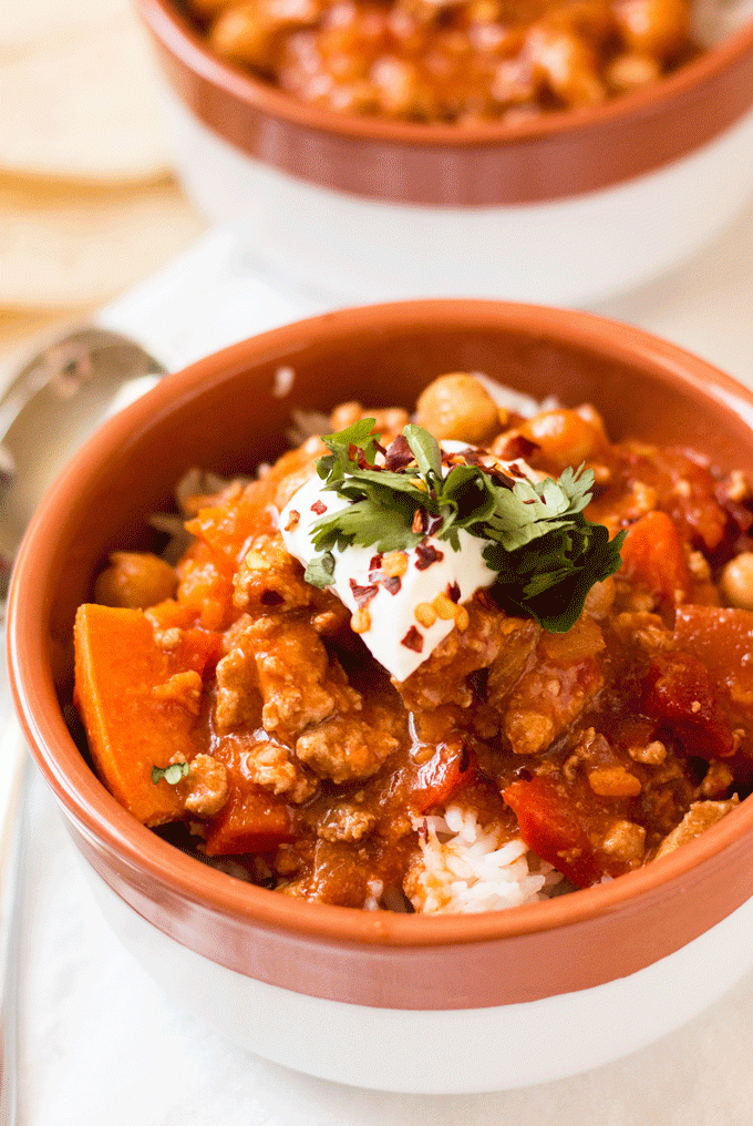 Instant Pot Turkey Chili in a bowl with garnish on top. 