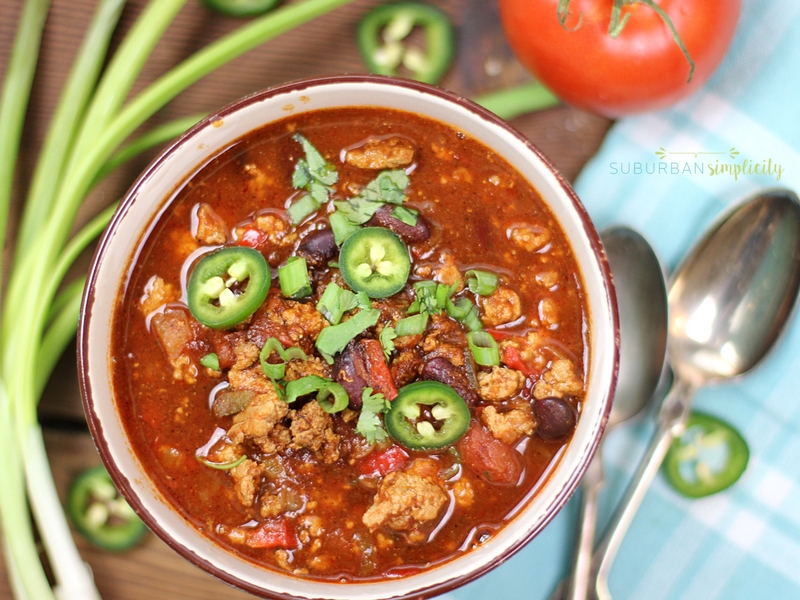 Crockpot Turkey Chili in a bowl topped with sliced jalapeño and cilantro.