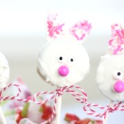 An adorable Easter bunny Oreo cookie pop with a ribbon around the stick.