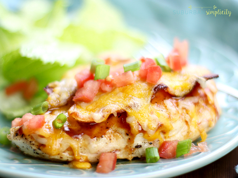 Monterey chicken on a plate with a side salad.