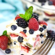 Easy Summer Berry Icebox Cake on a plate with a fork next to it.