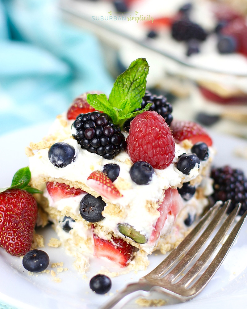 Easy Summer Berry Icebox Cake on a plate with a fork next to it.