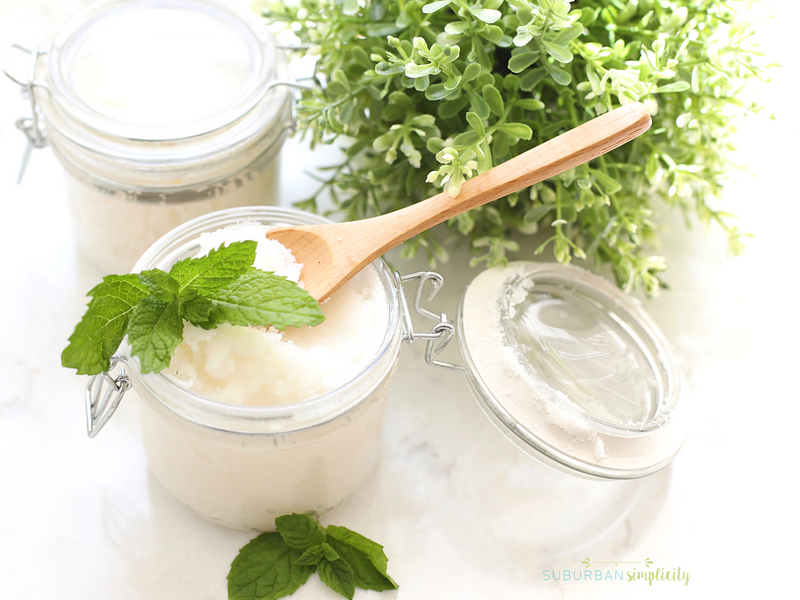Mint sugar scrub with a wooden spoon on top.