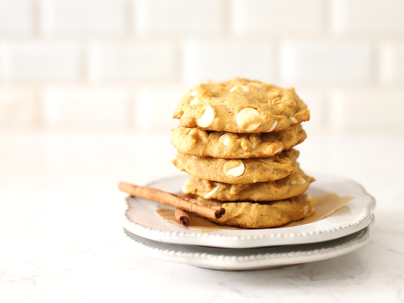 pumpkin spice cookies stacked on a plate.