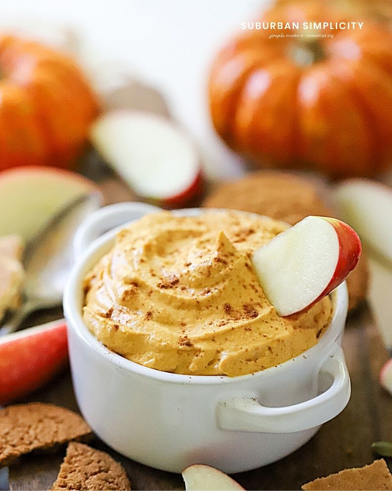 Recipe for pumpkin dip in a bowl with an apple