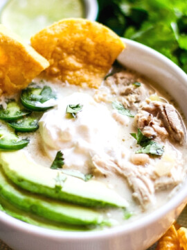 Crock Pot White Chicken Chili in a bowl topped with avocado and peppers
