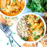 Instant Pot Butter Chicken in bowls with rice.