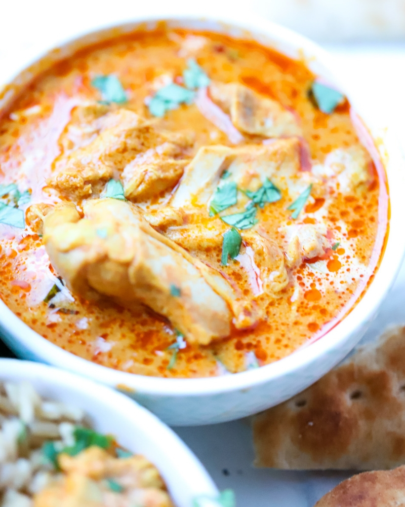 Instant Pot Butter chicken in a bowl with garnish