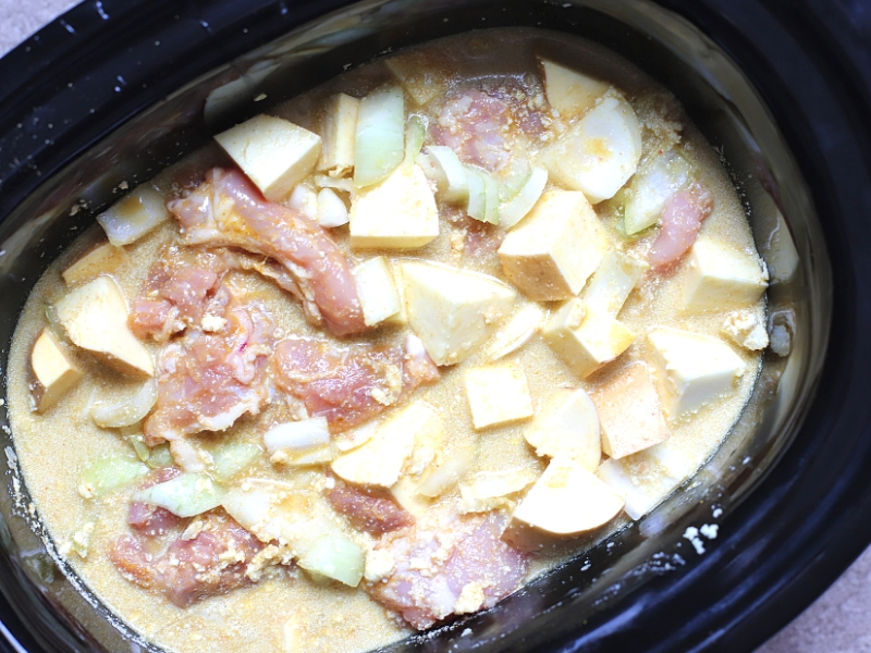 Slow Cooker Chicken Curry in a crock pot ready to cook.