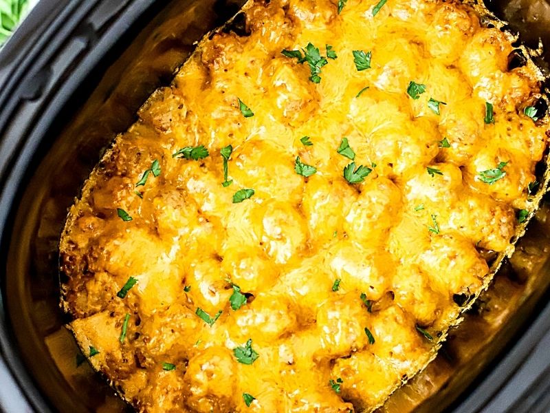a cooked tater tot casserole in the crockpot