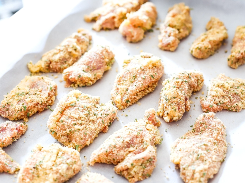 Chicken Tenders breaded and ready to go into the oven.
