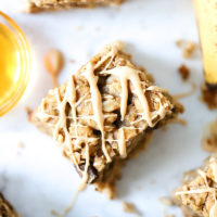 Oatmeal Banana Bars drizzled with white chocolate and peanut butter.