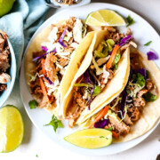 3 Crock Pot Pulled Pork Tacos on a plate.