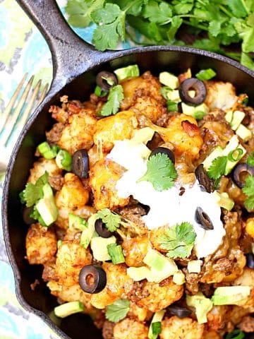 tater tot nachos in a cast iron pan