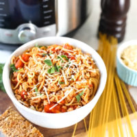 Instant Pot Spaghetti in a bowl with garlic bread.
