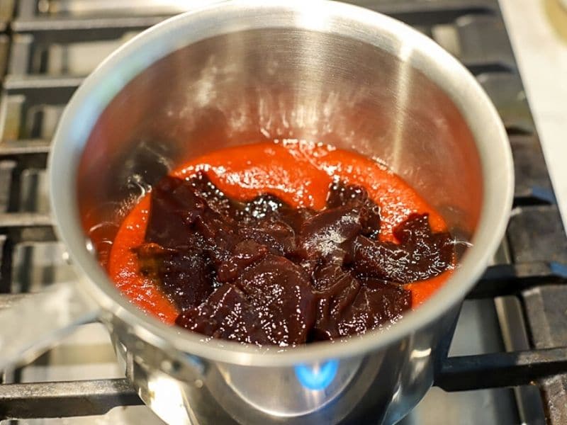 grape jelly and chili sauce in a pot