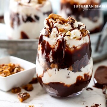 A chocolate toffee trifle in a glass with toffee bits