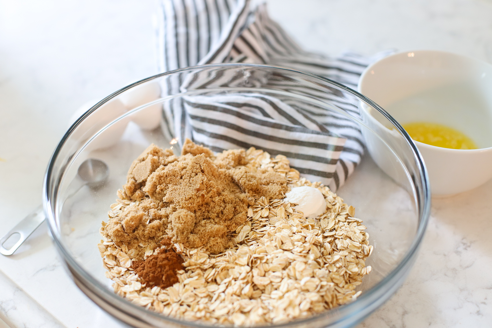 Oatmeal, brown sugar and cinnamon in a bowl.