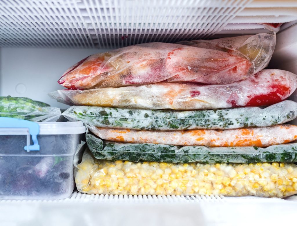 Frozen fruits and vegetables in freezer
