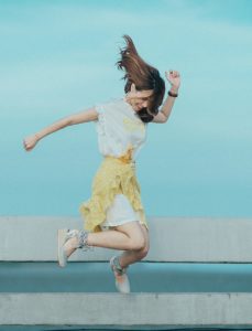 An excited lady jumping
