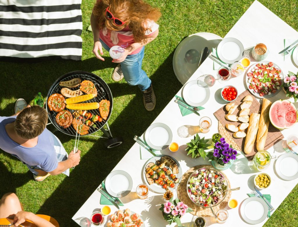 A group of people sitting at a table with a plate of food