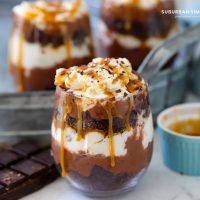 A Chocolate Caramel trifle next to a tray of more trifles.