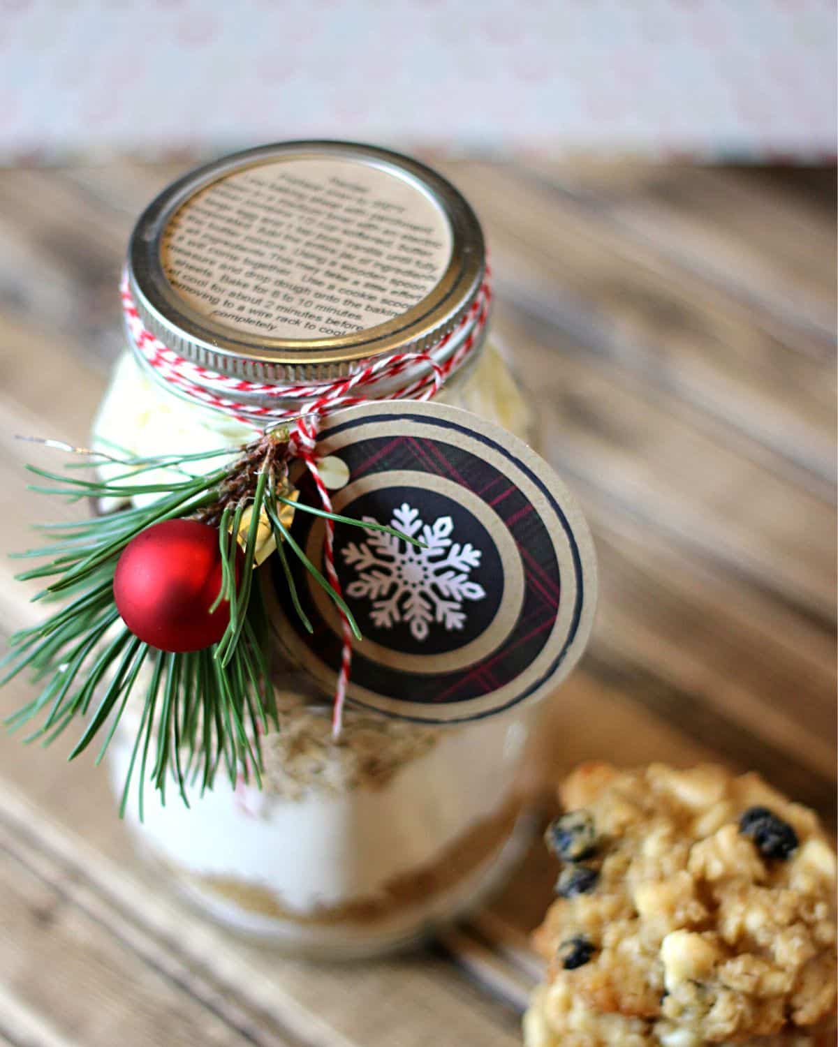 Mason jar with cookie ingredients layered inside.