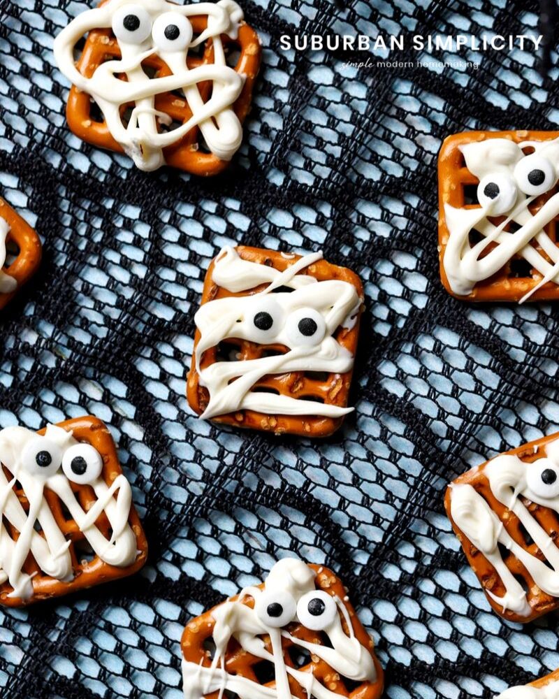 Mummy pretzels on a spider web background