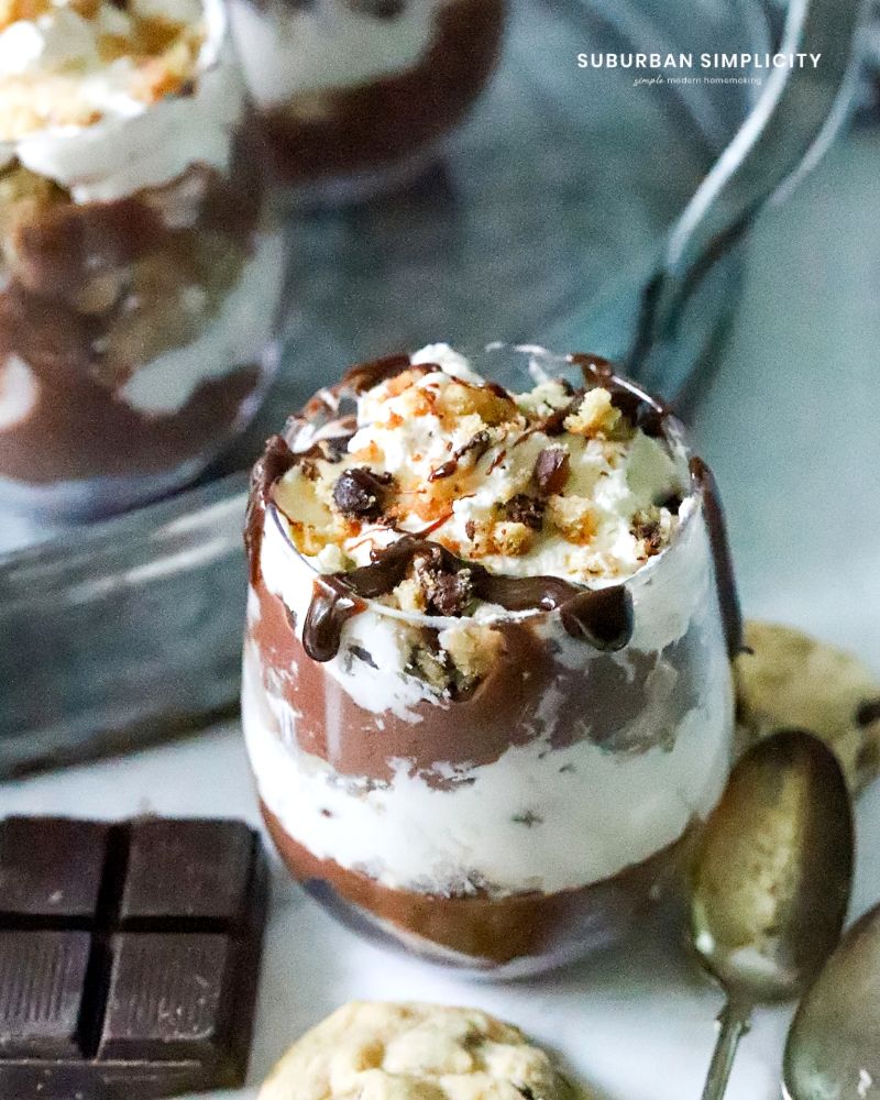 This Chocolate Chip Trifle is the ultimate in decadence while being incredibly easy to prepare. Simple chocolate pudding and whipped cream are made special with chocolate chip cookie crumbles and a drizzle of chocolate syrup.