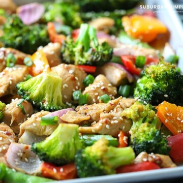 Try this easy Sheet Pan Sesame Chicken and Veggies tonight! Tender chicken is marinated in a delicious Sesame sauce and baked to perfection in 30 minutes. You and your family are going to love this simple recipe. 