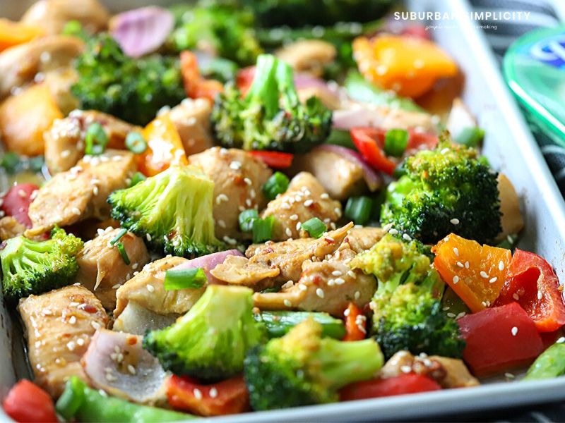 Try this easy Sheet Pan Sesame Chicken and Veggies tonight! Tender chicken is marinated in a delicious Sesame sauce and baked to perfection in 30 minutes. You and your family are going to love this simple recipe. 