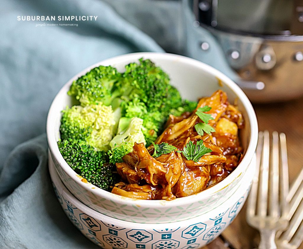 A bowl of food with broccoli, with Chicken made in the Slow cooker