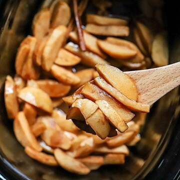 Crockpot Apples with Cinnamon takes minutes to prep and tastes fantastic. These slow-cooked, tender and flavorful apples are great for breakfast on oatmeal and pancakes or served with ice cream for dessert! Baked apples have never been so easy.