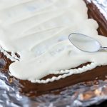 white chocolate being spread in a pan