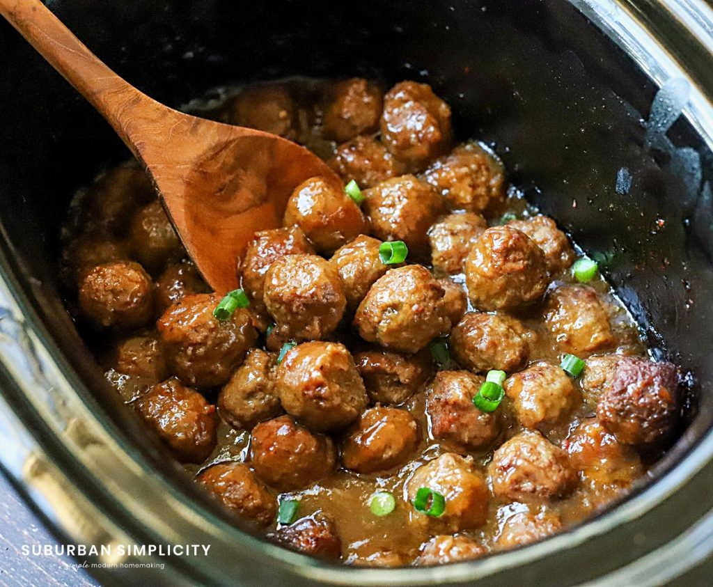 Slow cooker teriyaki meatballs topped with green onions