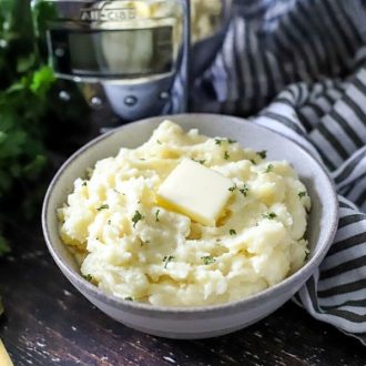 mashed potatoes in a bowl with butter on top