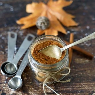 pumpkin spice mix in a jar with a spoon