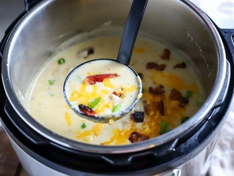 potato soup being ladled out of the instant pot