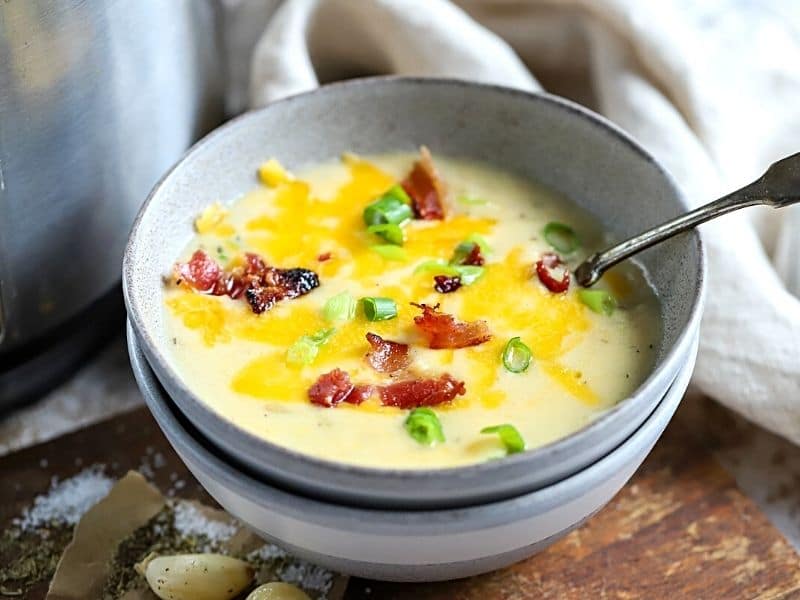 potato soup in a bowl with cheese and bacon