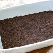 Oreo crust in a pan.