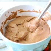 Pudding with whipped topping in a bowl.